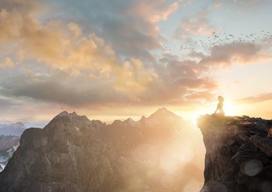Woman experiencing oneness meditation on a mountain