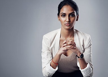 Woman sitting with hands together